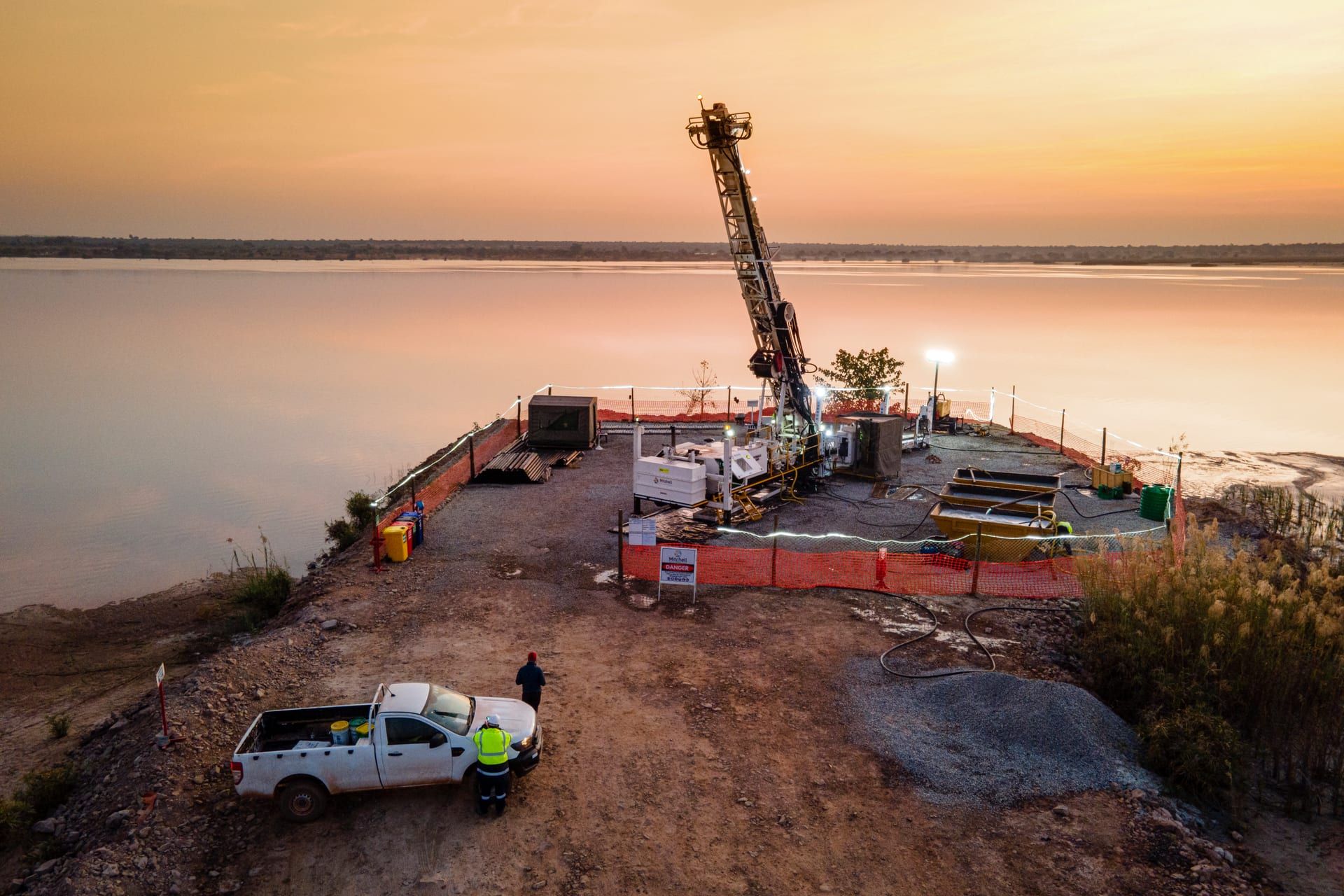 Mitchell Drilling rig operating on a lake at first light
